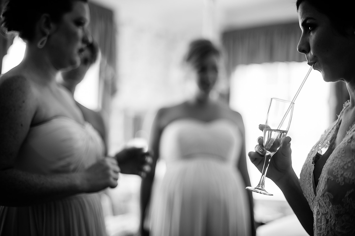bride drinking champagne with straw at the greenbrier resort