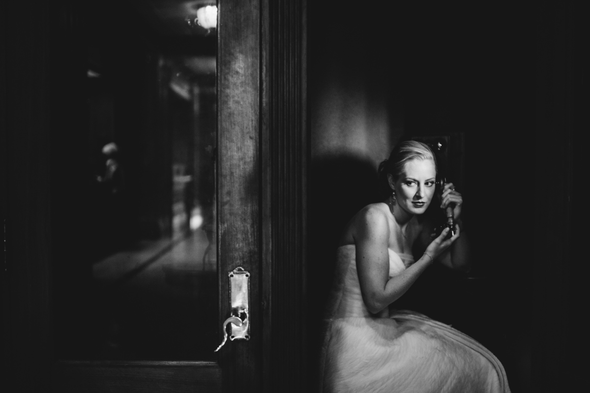 noir bridal portrait in old telephone booth