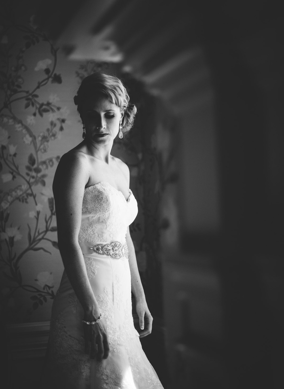 elegant bridal portrait by window black and white