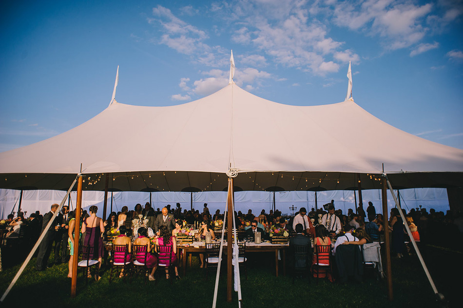 summer wedding reception classy tent at dusk