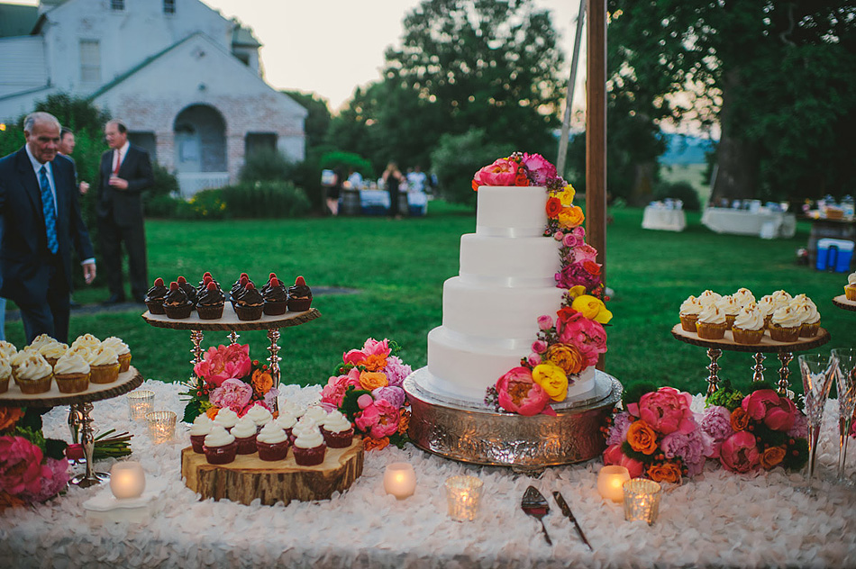 beautiful wedding cake and cupcakes