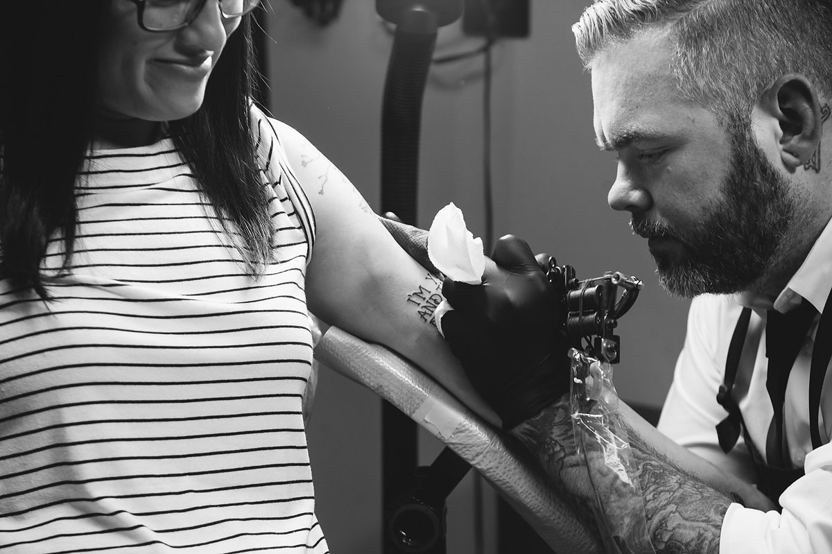 engagement session at a tattoo shop