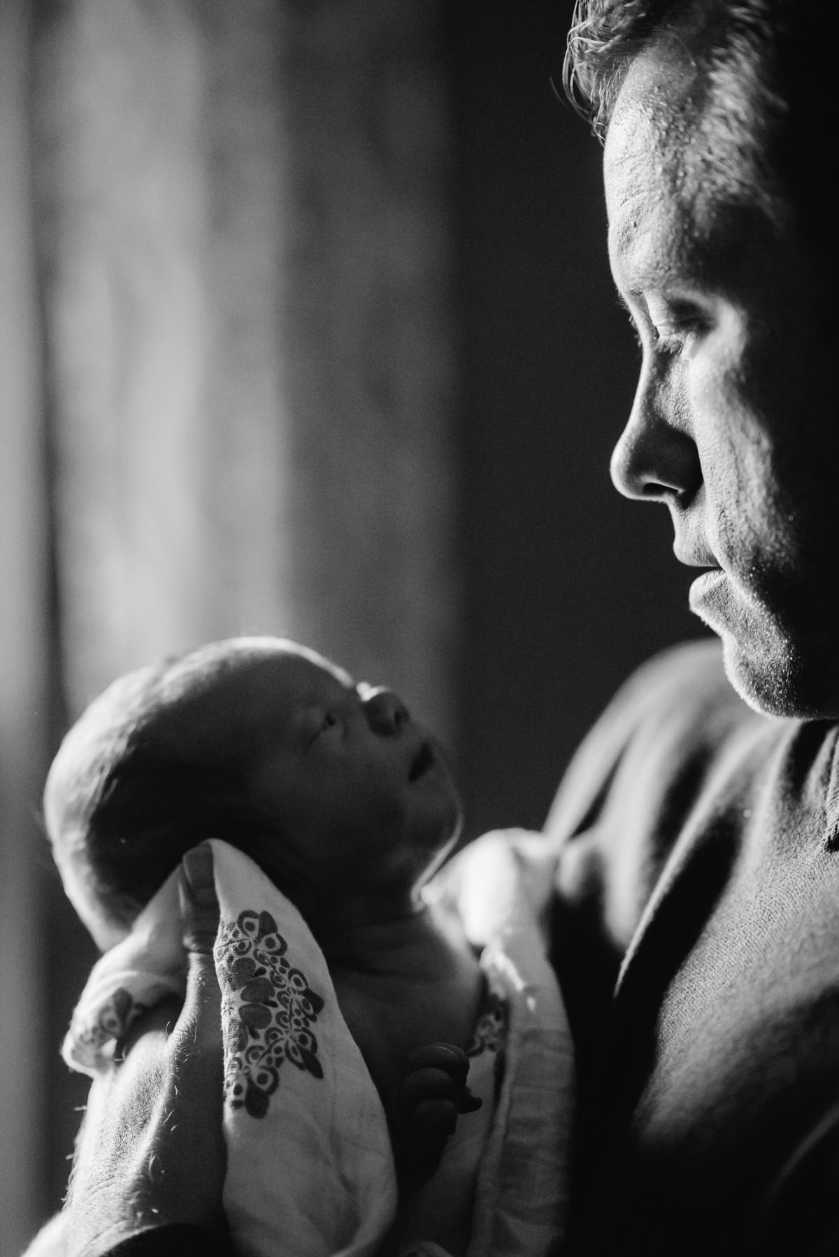black and white newborn with dad photo by best wv photographers the oberports
