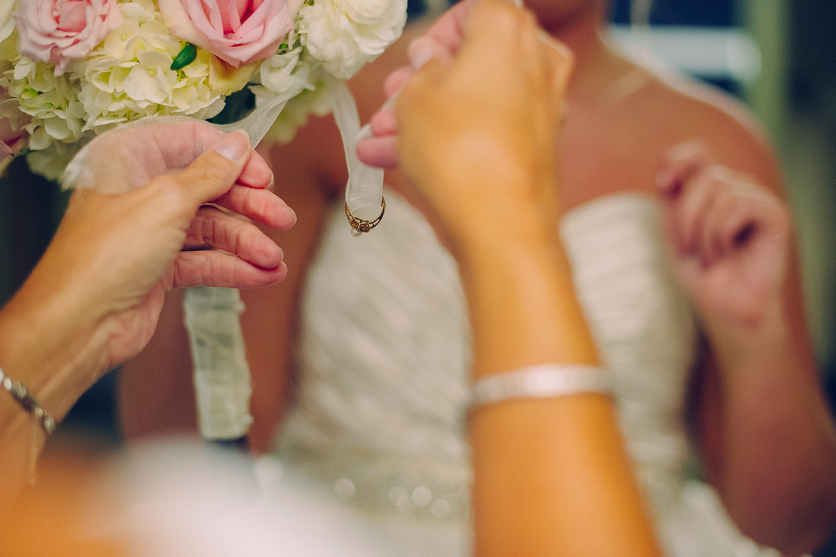 tying ring onto bouquet