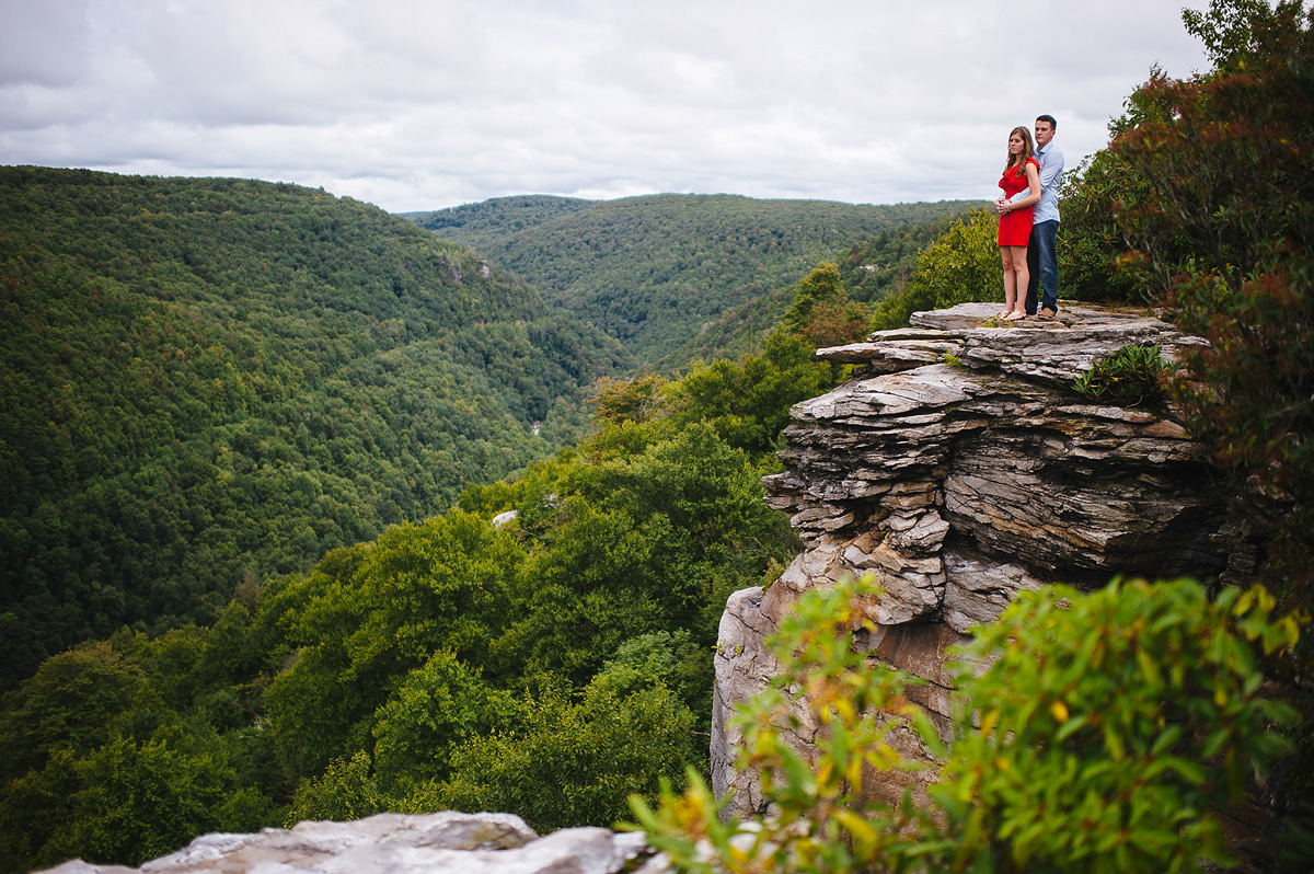 portrait of newly engaged couple on overlook at blackwater falls state park