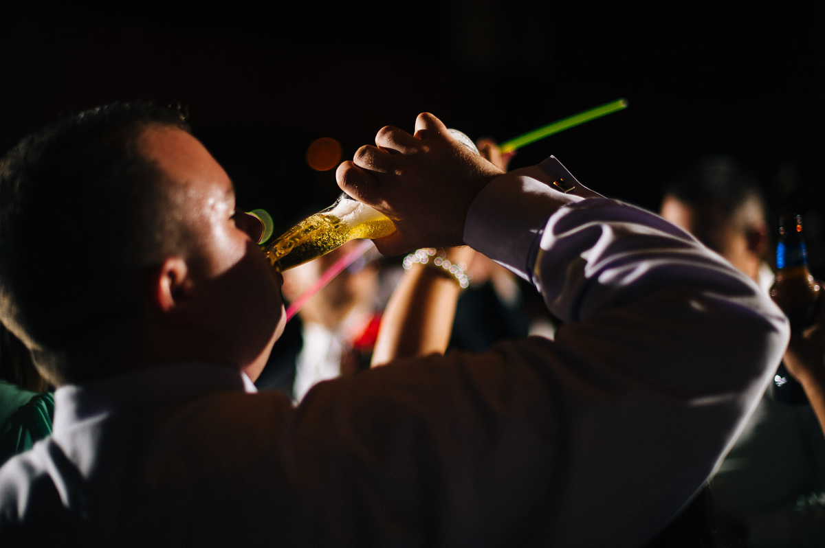 wedding reception drinking beer glowsticks by pittsburgh wedding photographers the oberports