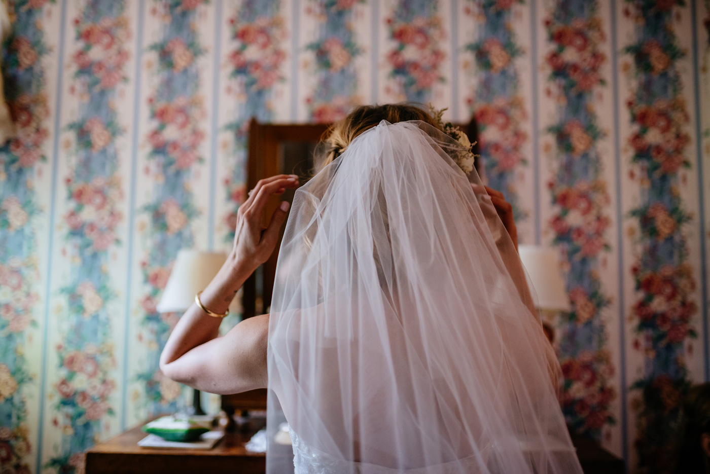bride adjusting her veil