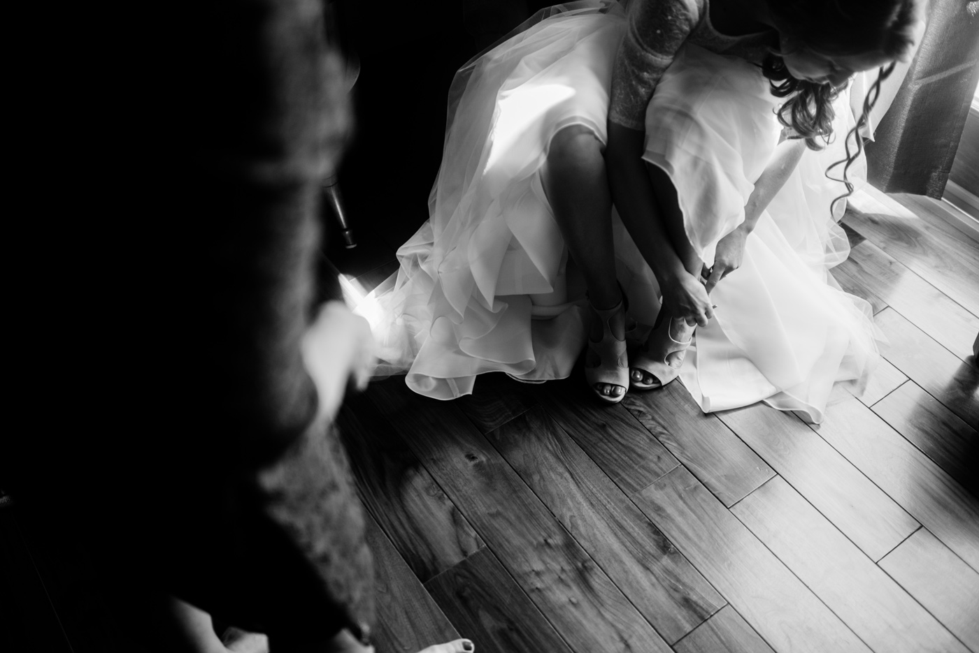 bride putting shoes on west virginia wedding