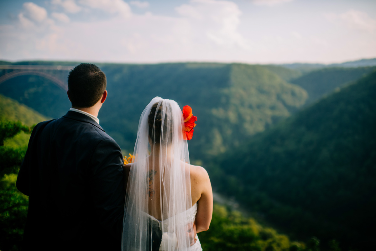 bride and groom overlook the new river gorge