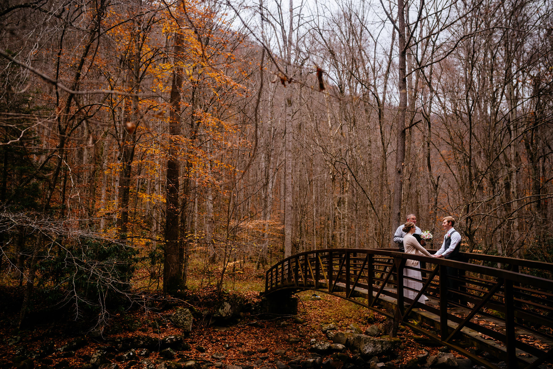 ceremony on bridge autumn wv hiking elopement