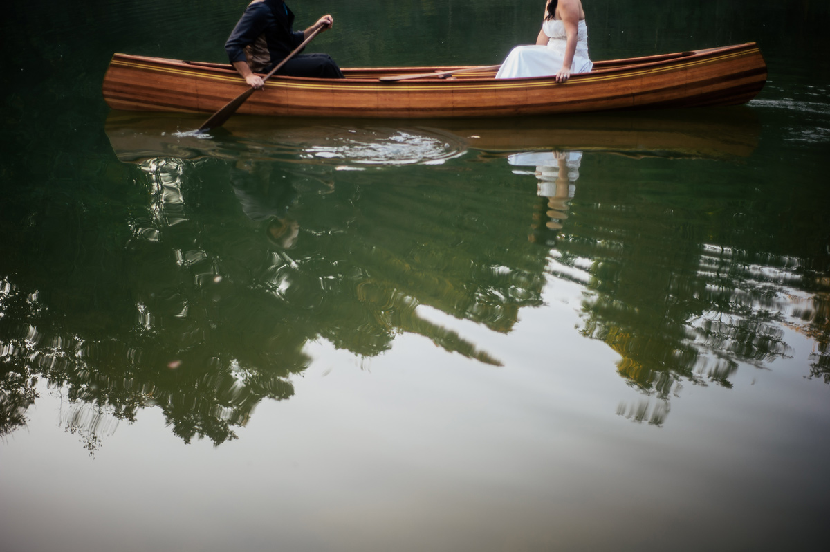 portrait of a bride and groom in canoe