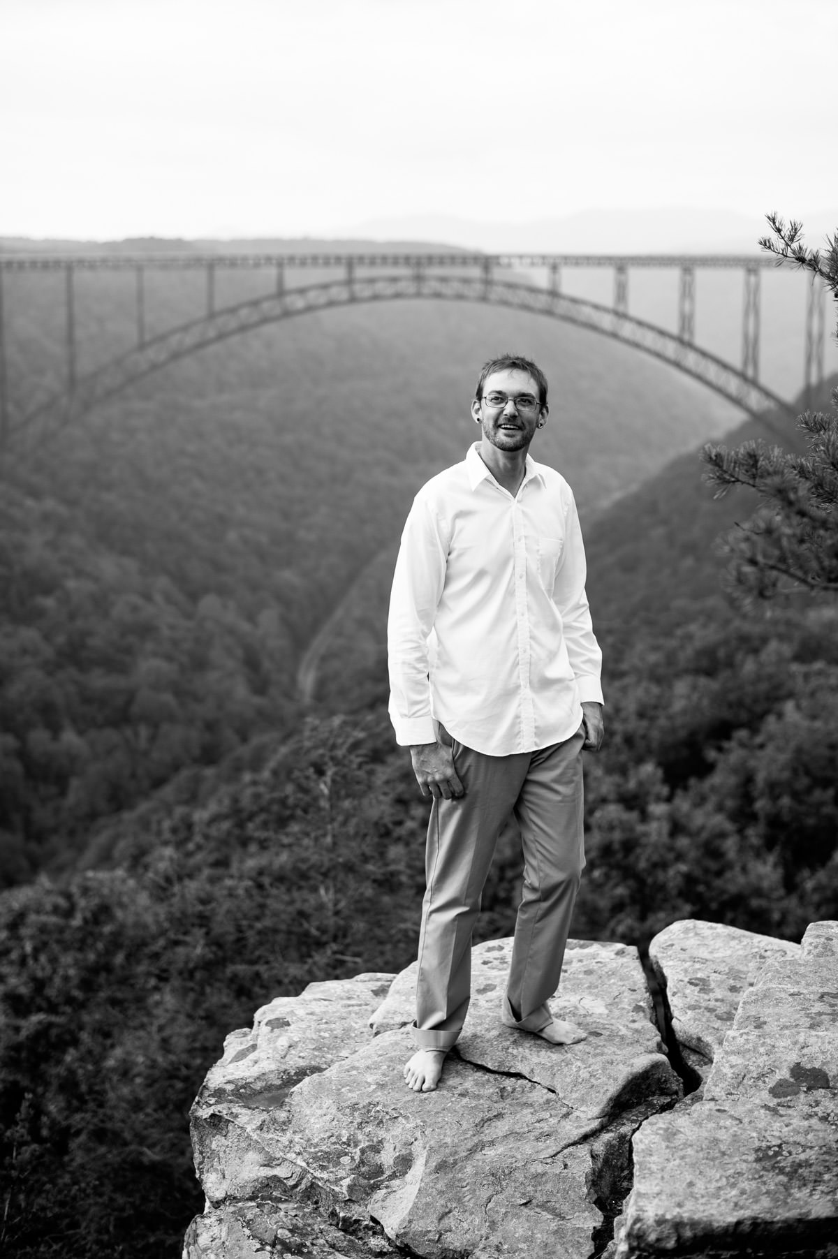 black and white groom portrait at new river gorge overlook