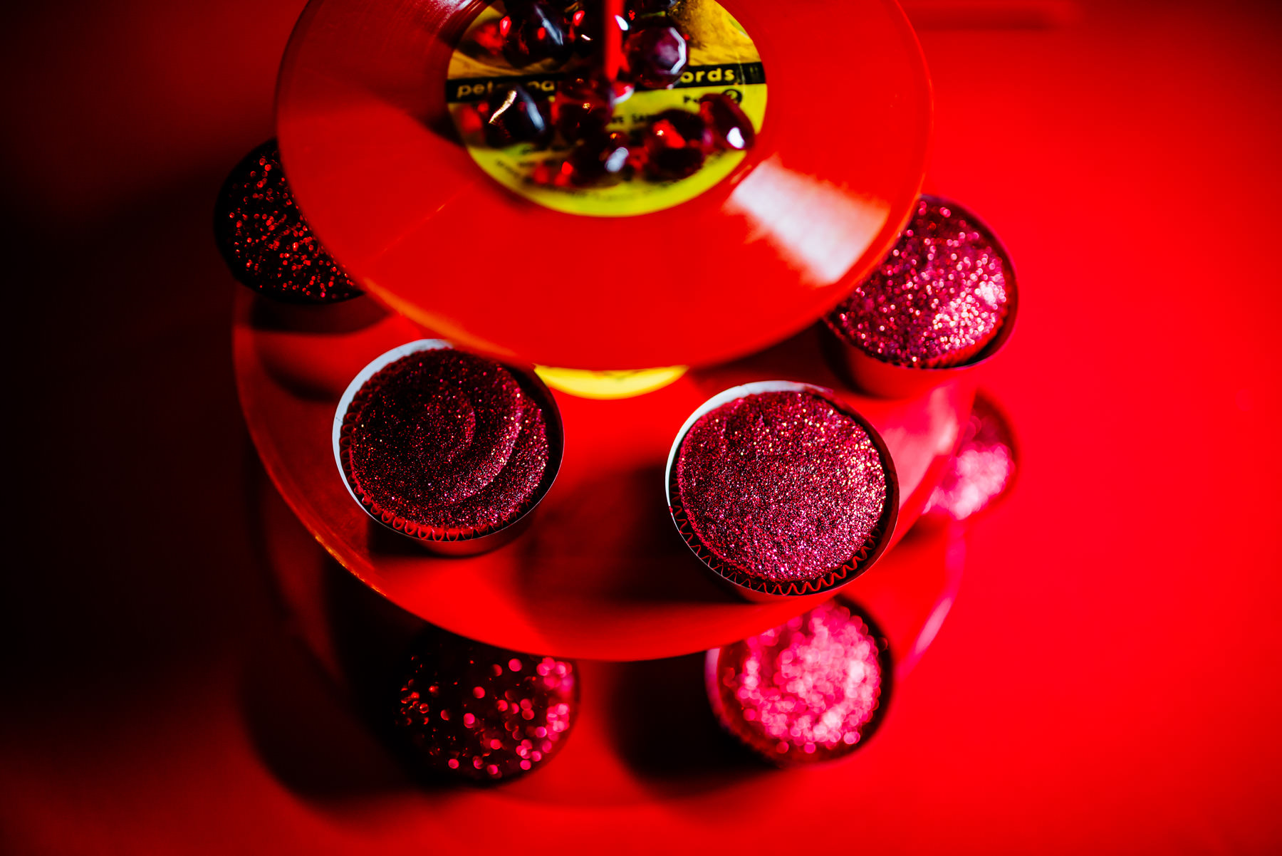 glittery cupcakes on a red lp cupcake stand