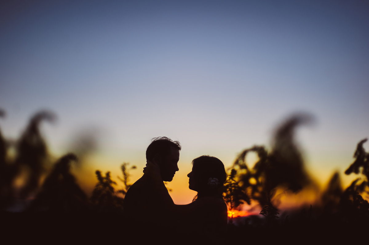 beautiful bride and groom portrait at sunset at fallingwater