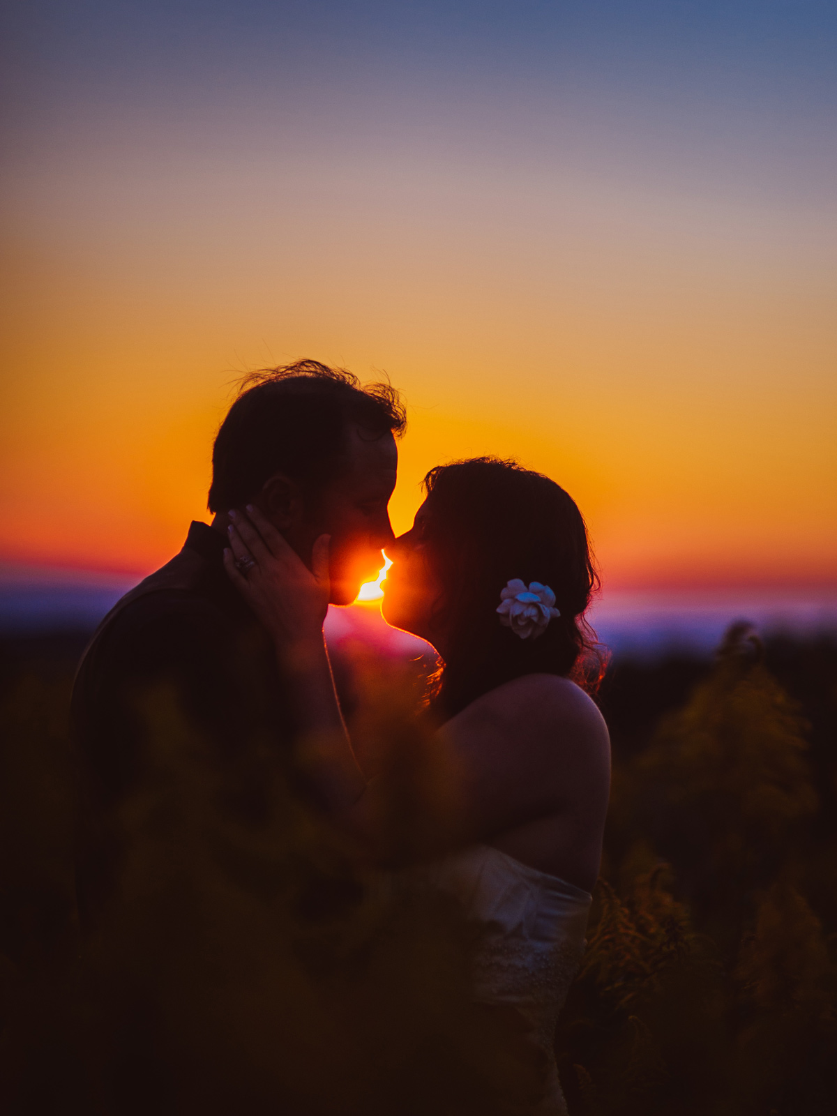 bride and groom portrait at sunset silhouette
