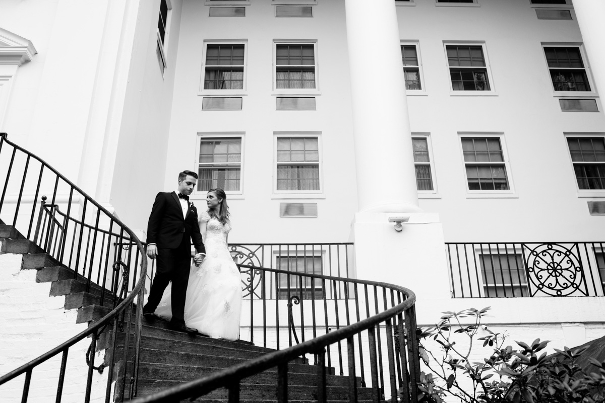 bride and groom walking down stairs at the greenbrier resort