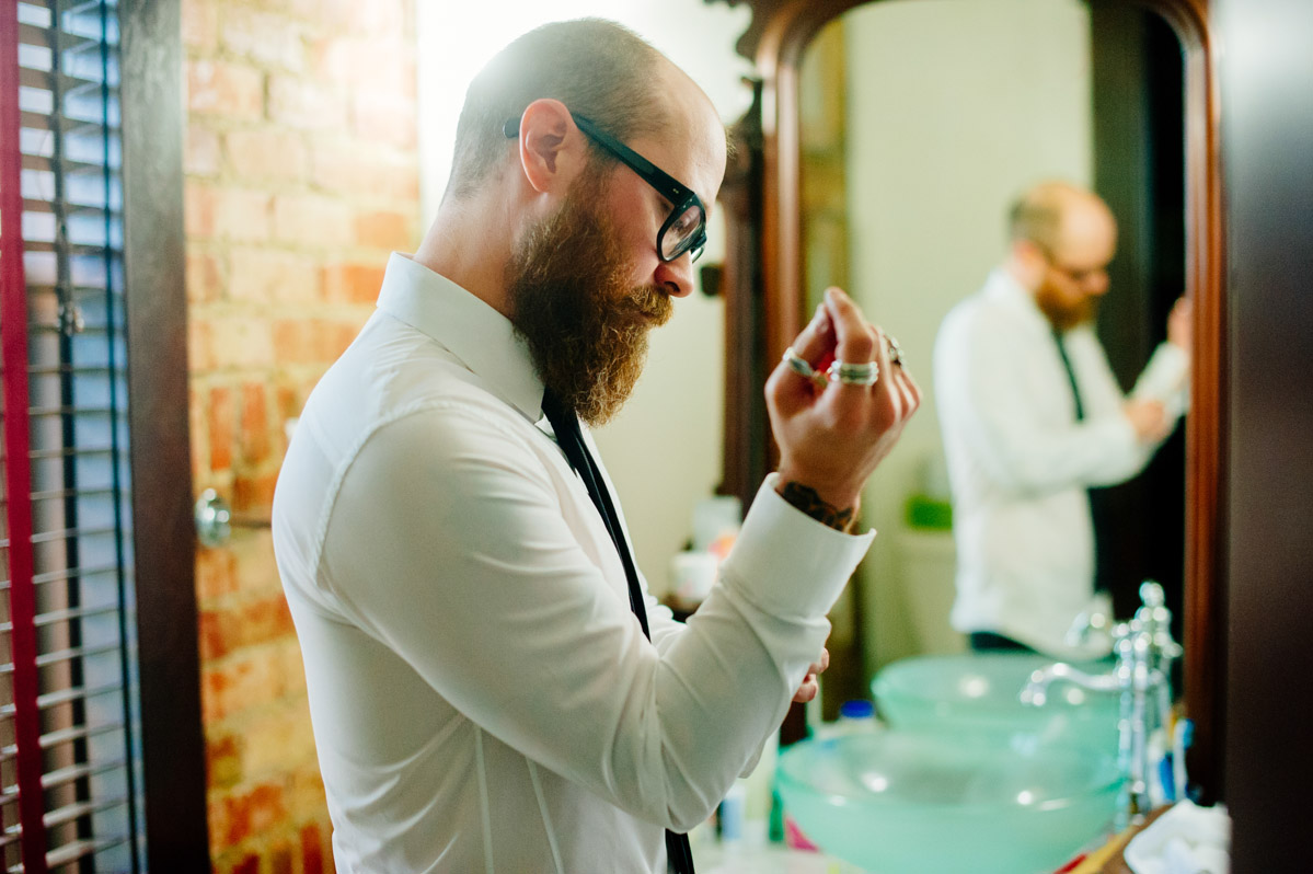 bearded groom getting dressed designer rings fashion inspiration