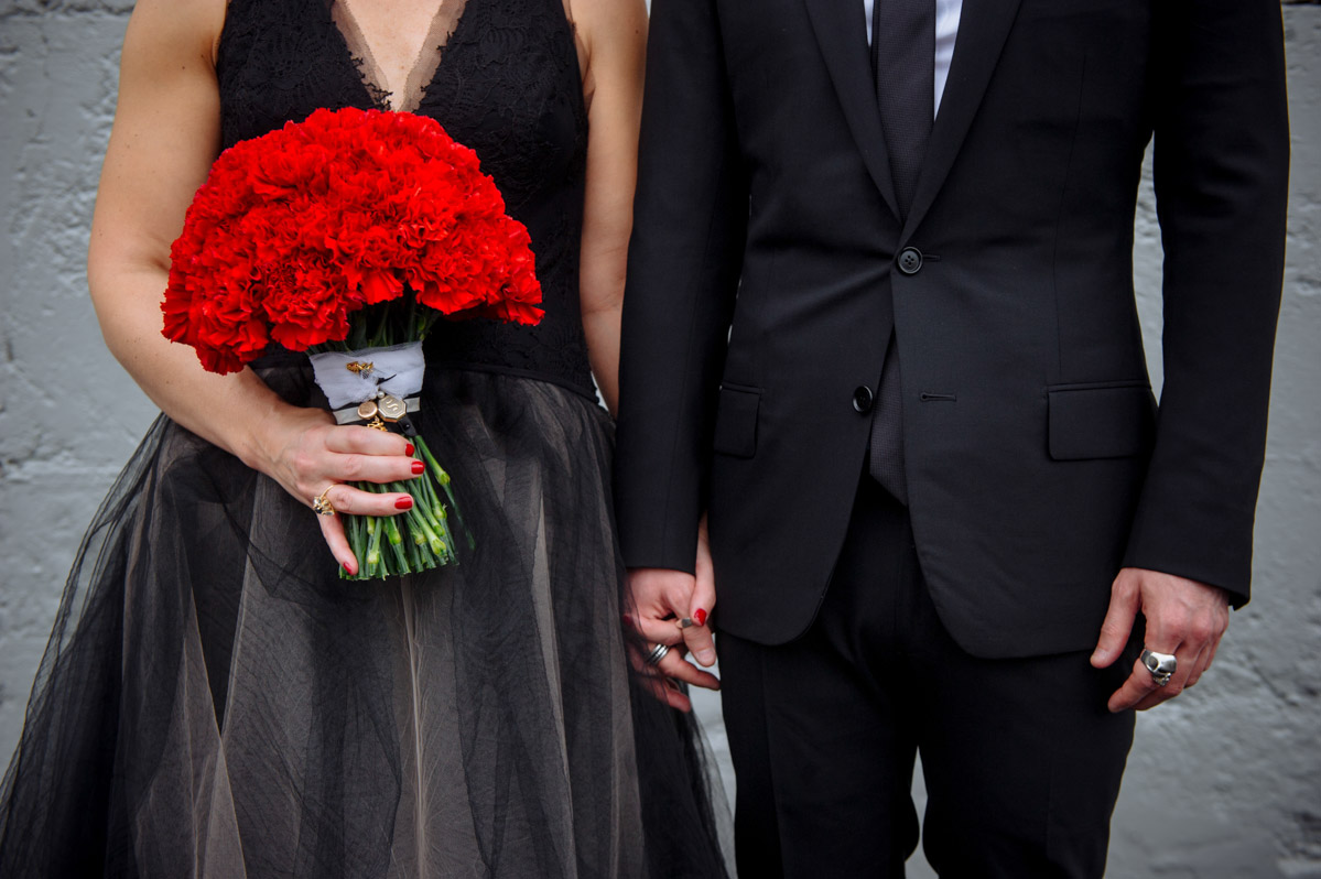 wedding details vera wang black dress dior homme suit red carnations bouquet