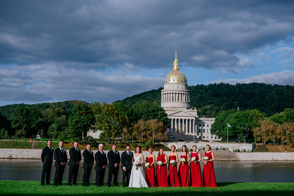 wedding party portrait on uc lawn overlooking wv state capitol gold dome