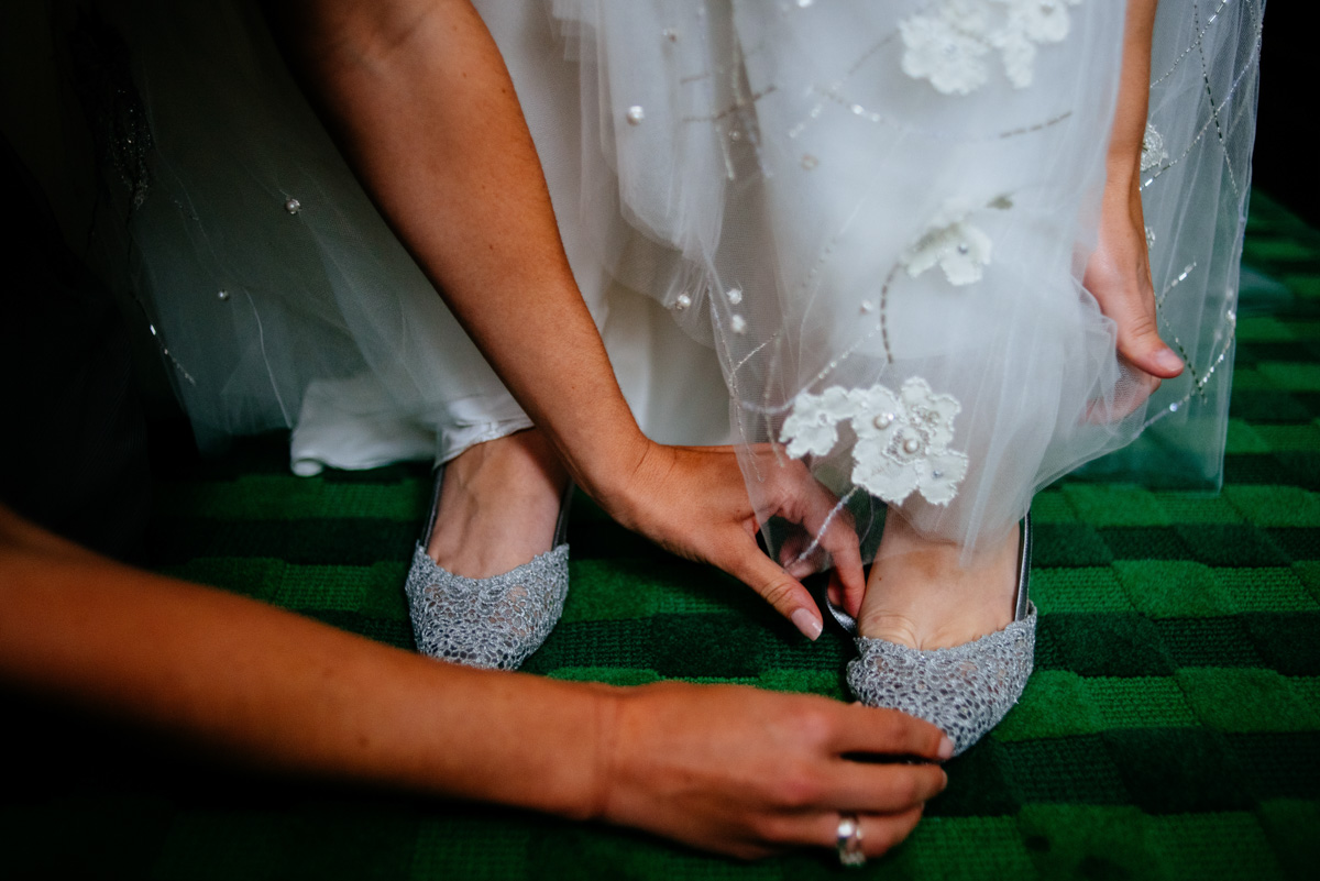 bride getting into shoes at the greenbrier resort