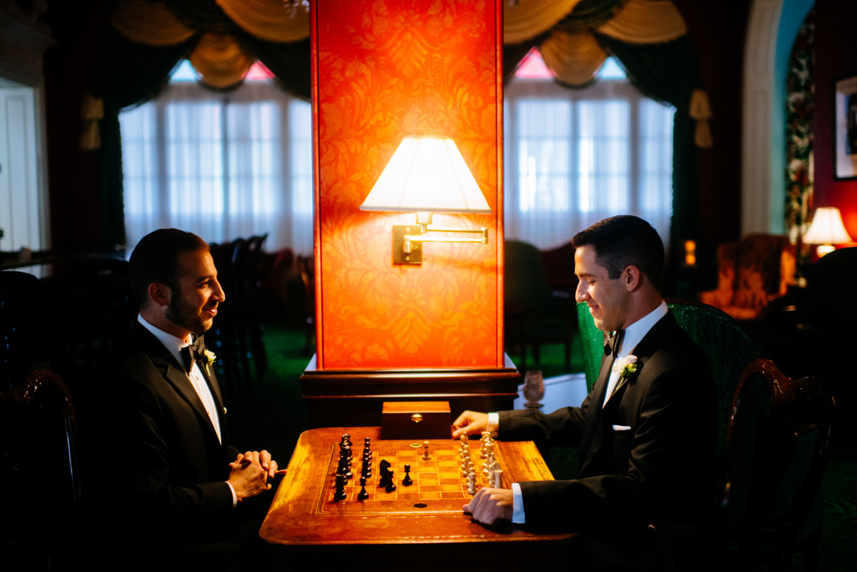 groomsmen playing chess at the lobby bar at the greenbrier