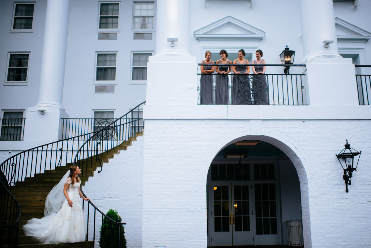 bride on stairs with bridesmaids at the greenbrier