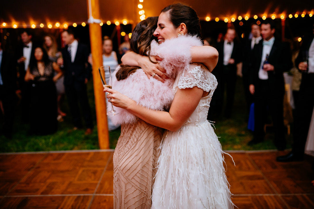 sisters hug on wedding day