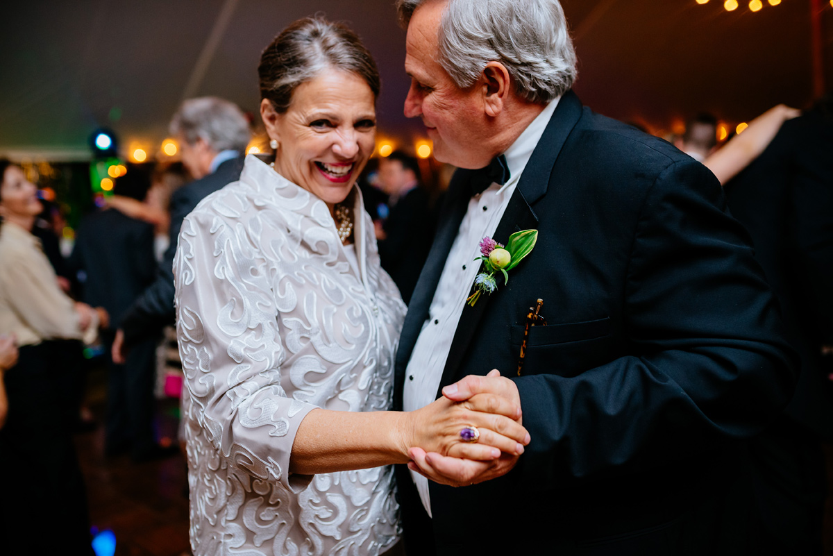parents of the bride dancing at wedding reception