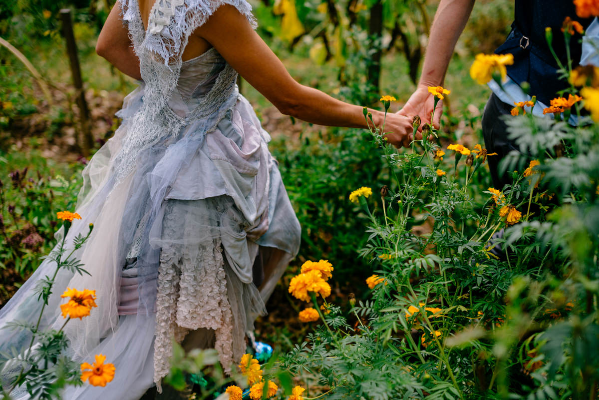 woodland punk rock wv wedding bride and groom walking through garden