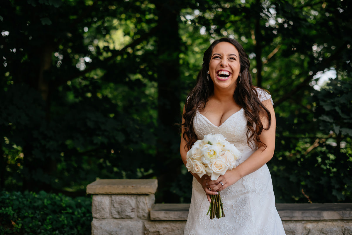 bride laughing in the summertime