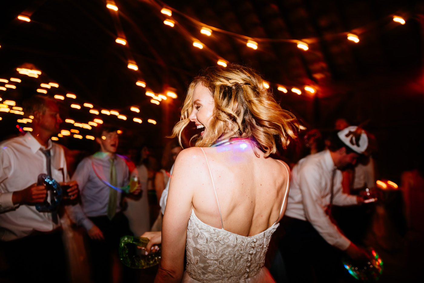happy bride dancing at wedding reception