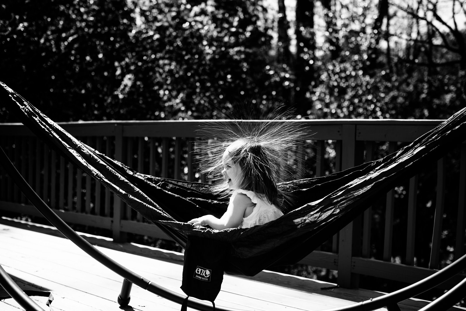 kid in hammock with static hair