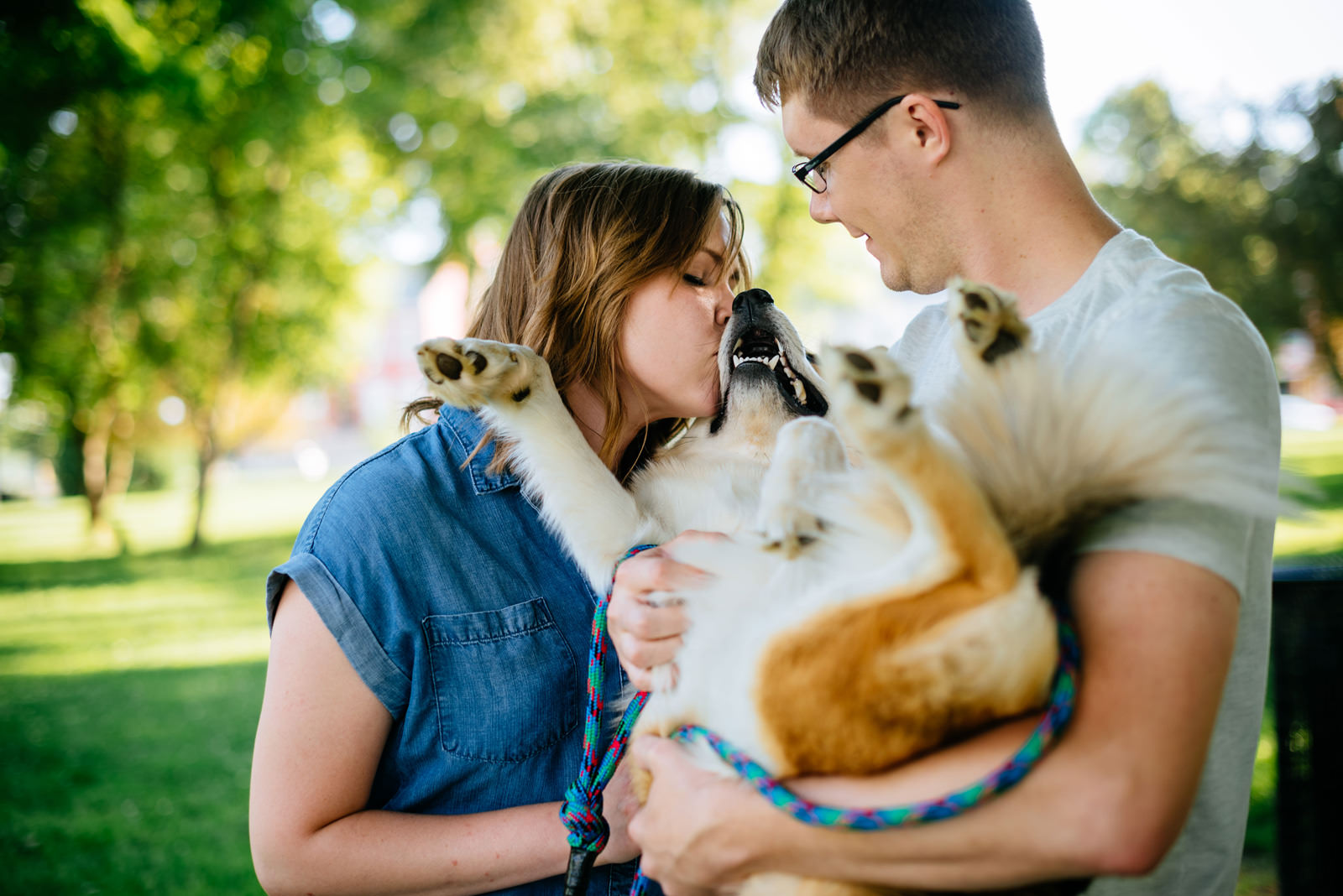 loving on a dog during engagement session