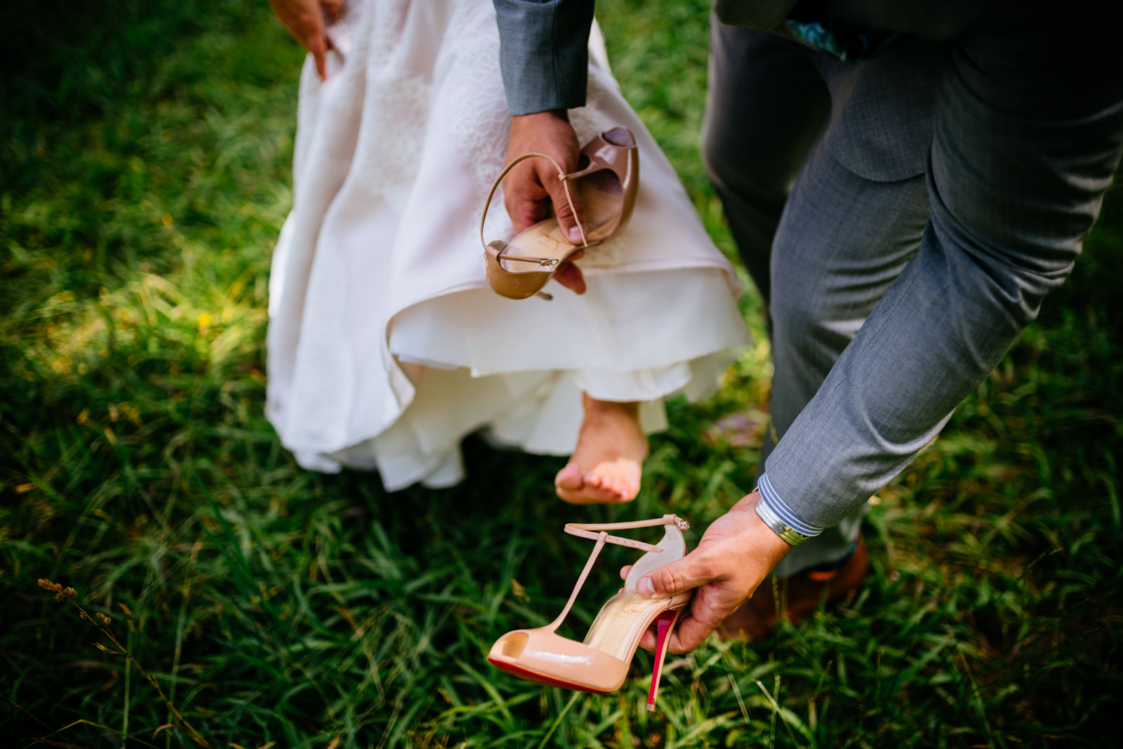 groom puts on bride shoes