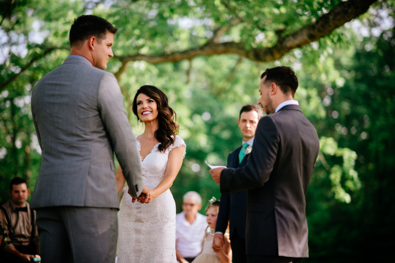 happy bride during ceremony ceremony under white oak tree gaines estate fayetteville wv wedding