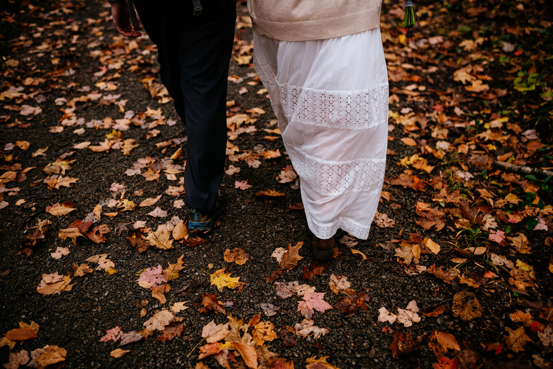 bride groom walking through leaves wv hiking elopement