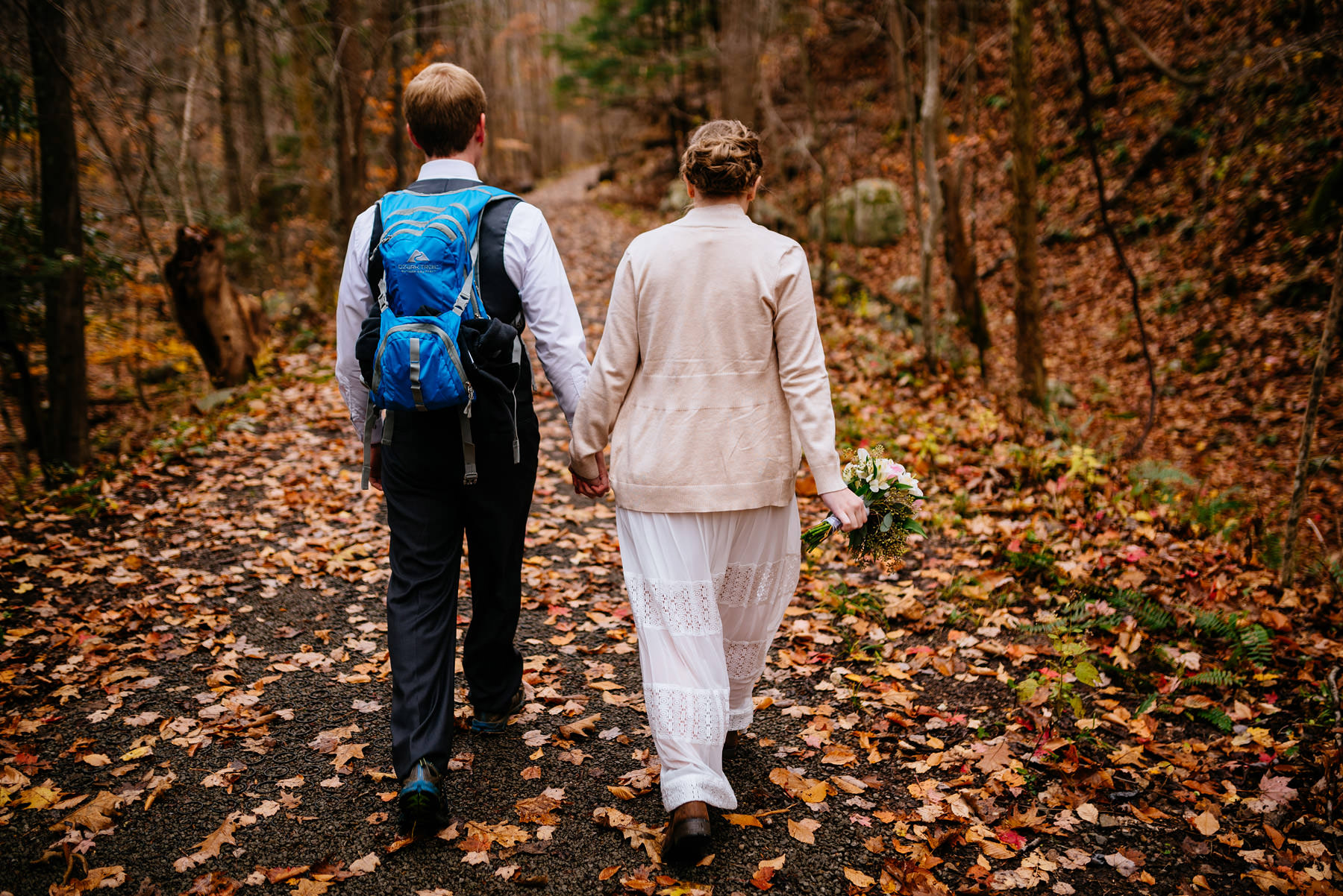 bride groom walking through forest wv hiking elopement