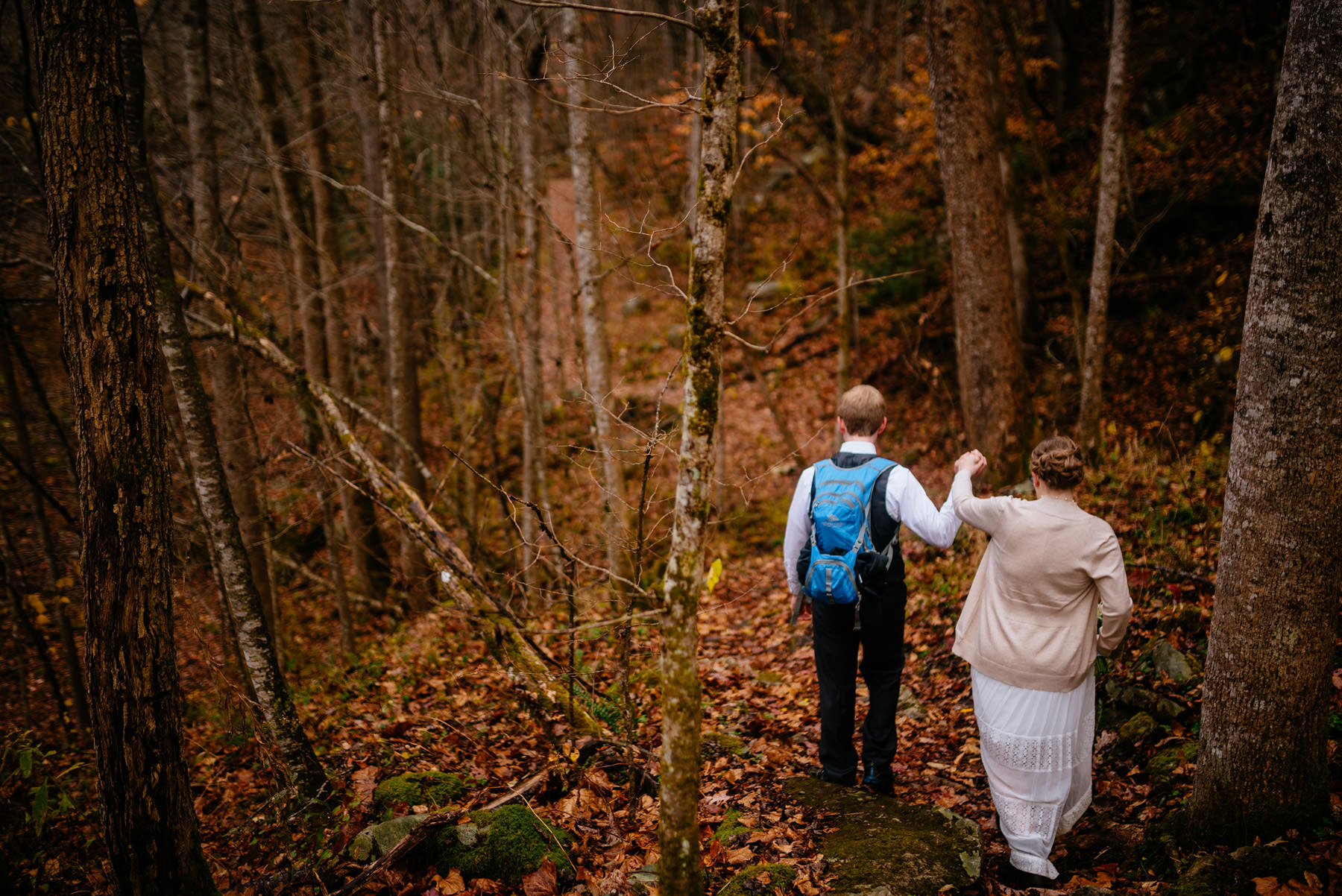 bride groom walking through glade creek wv hiking elopement