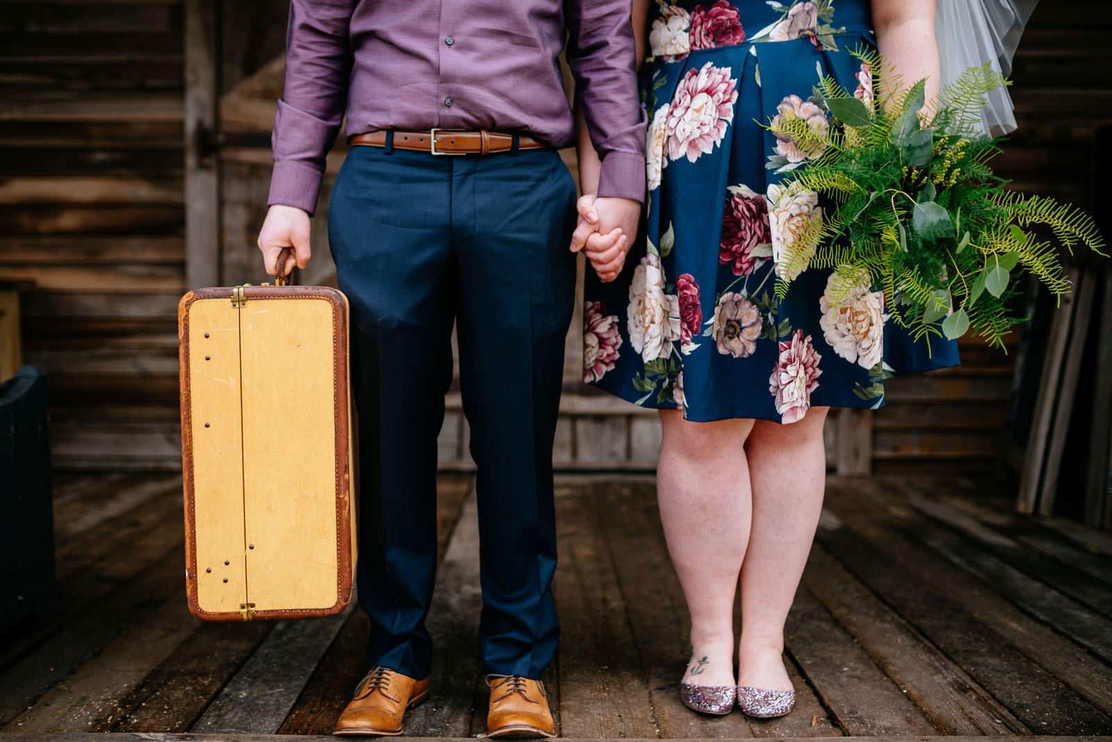 bride and groom with bouquet and suitcase terrain elopement