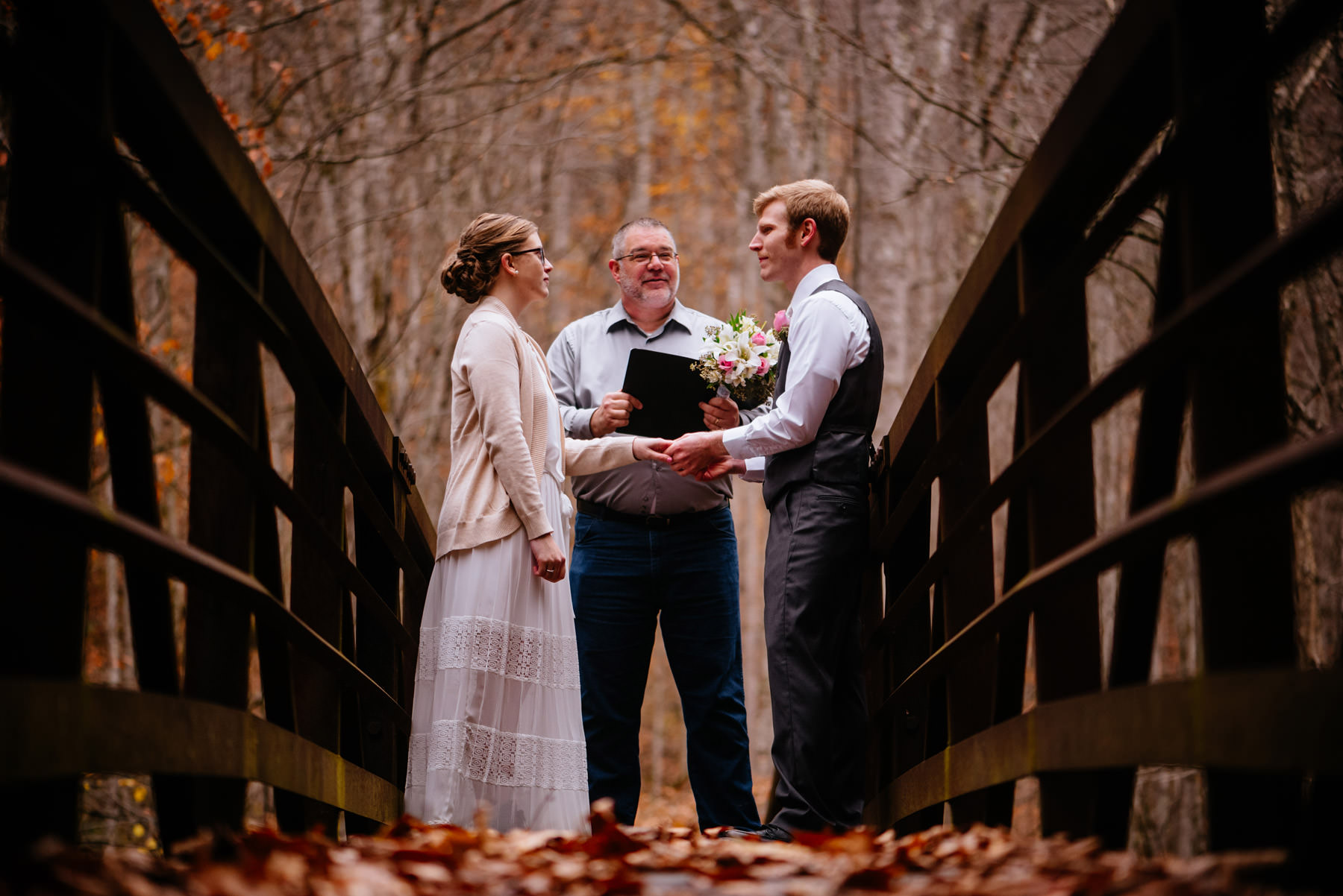 ceremony on bridge autumn wv hiking elopement