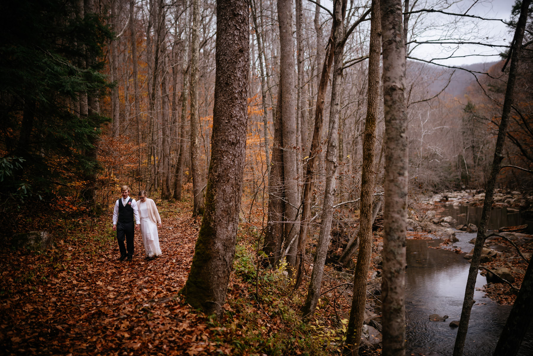 bride groom walking along glade creek wv hiking elopement