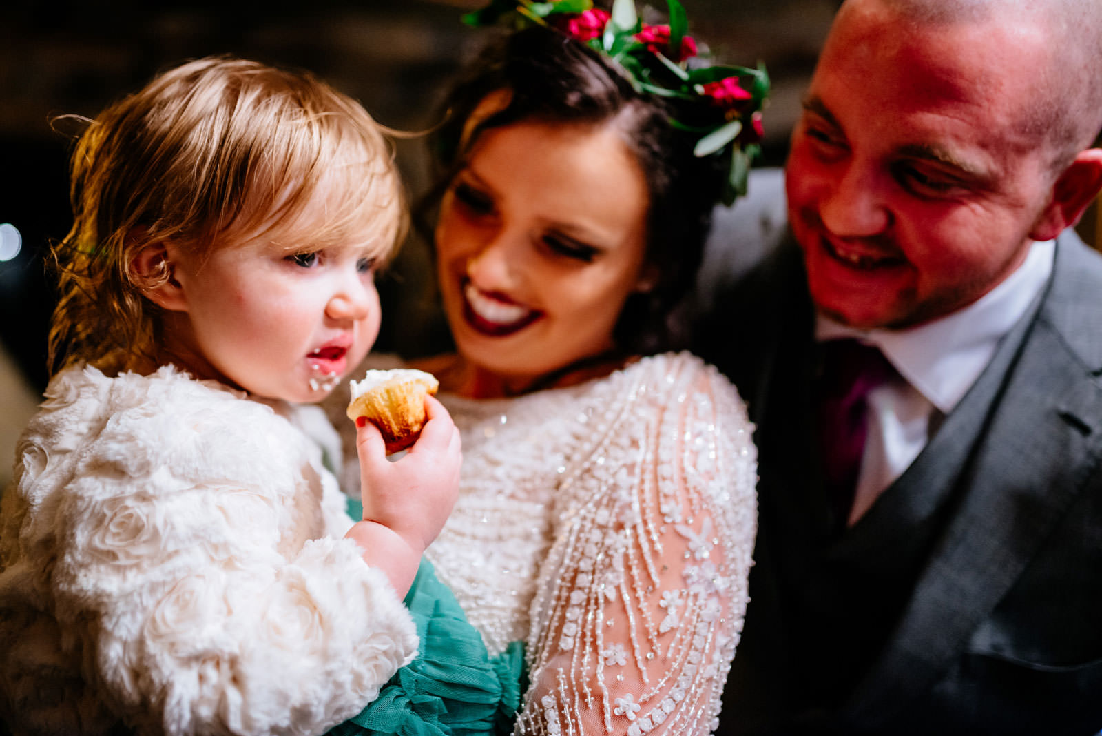 bride groom kid eating cupcake at wedding