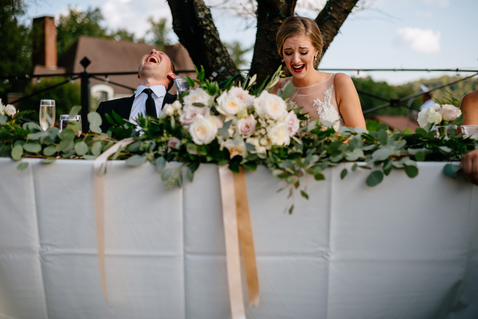 bride groom laughing during toasts zenner house wedding reception