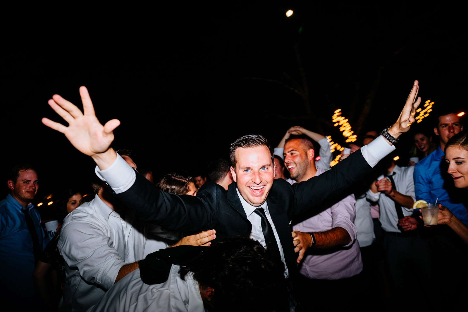 happy groom during wedding reception