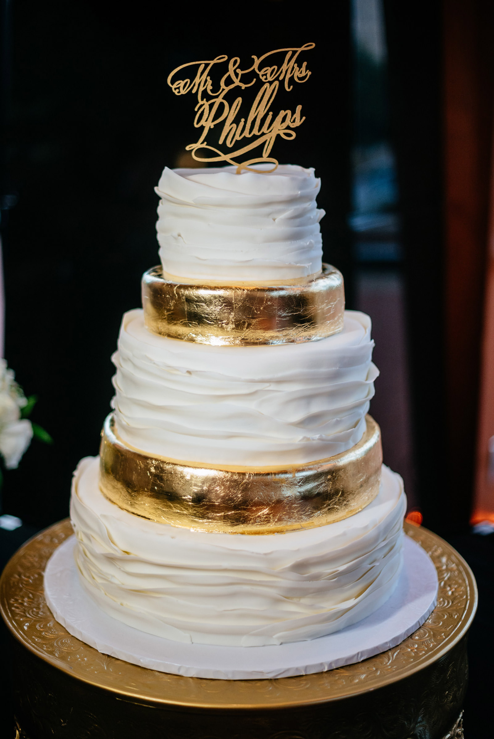 clay center wedding cake gold foil