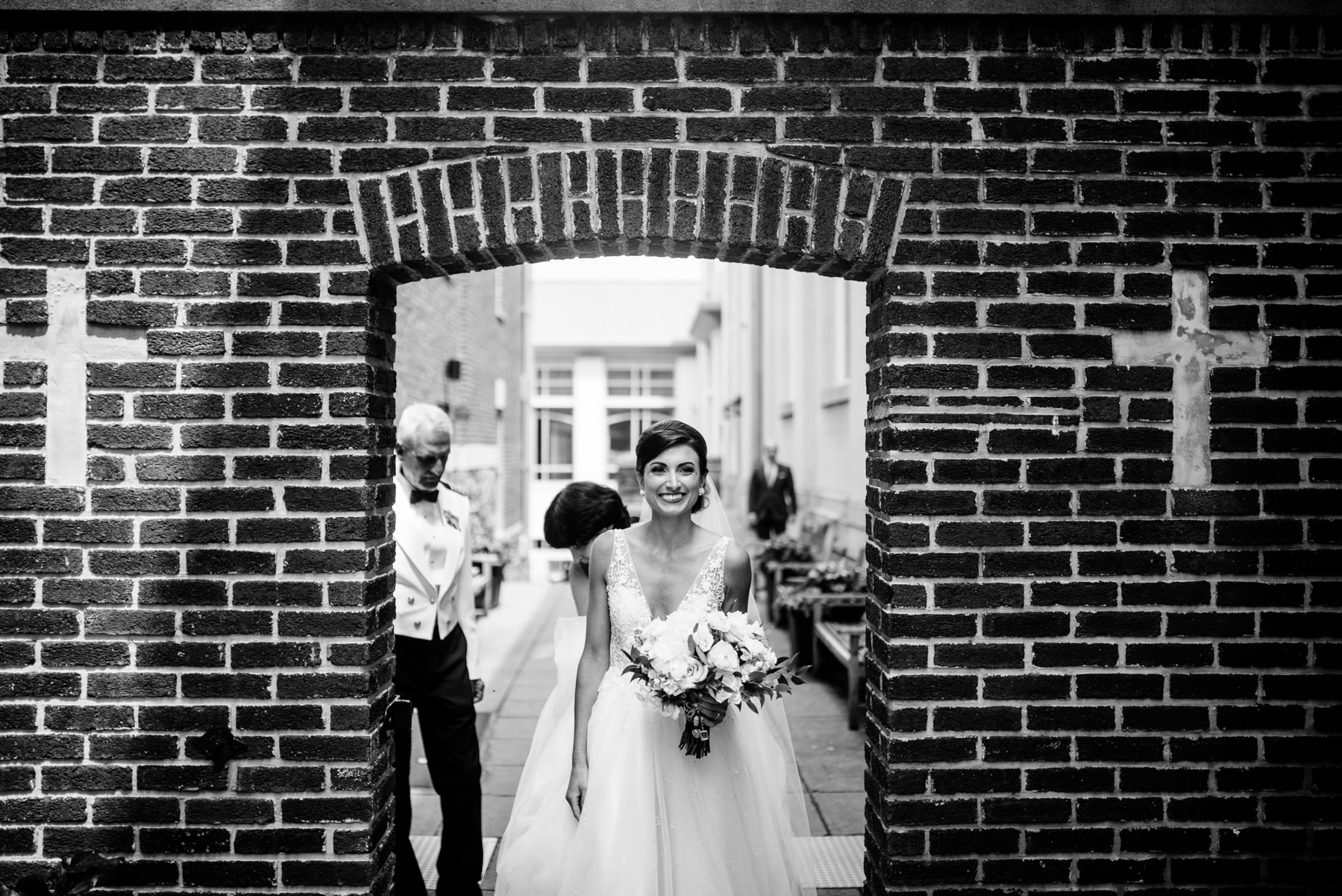 bride walking through archway