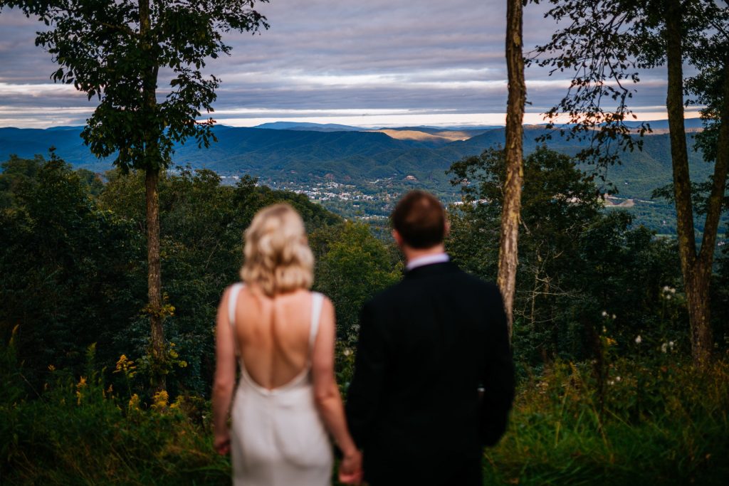 bride and groom looking out at greenbrier sporting club wedding