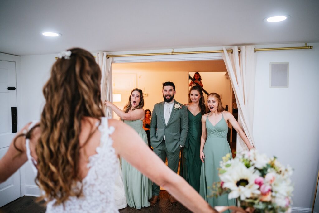 wedding party seeing bride in her dress