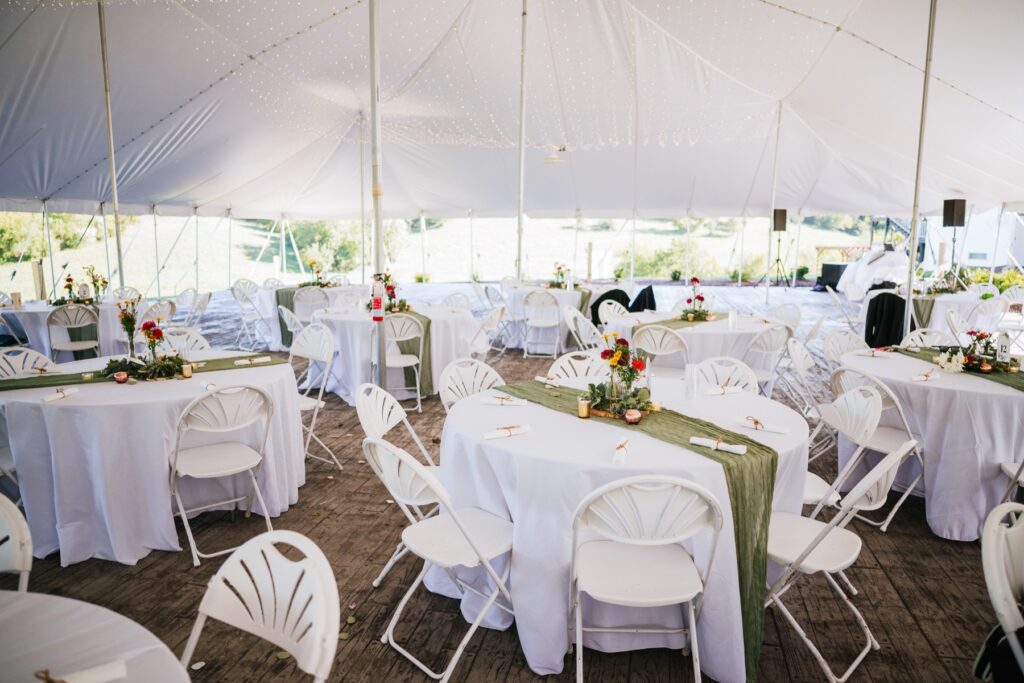 wedding table setup under the tent at batten green venue
