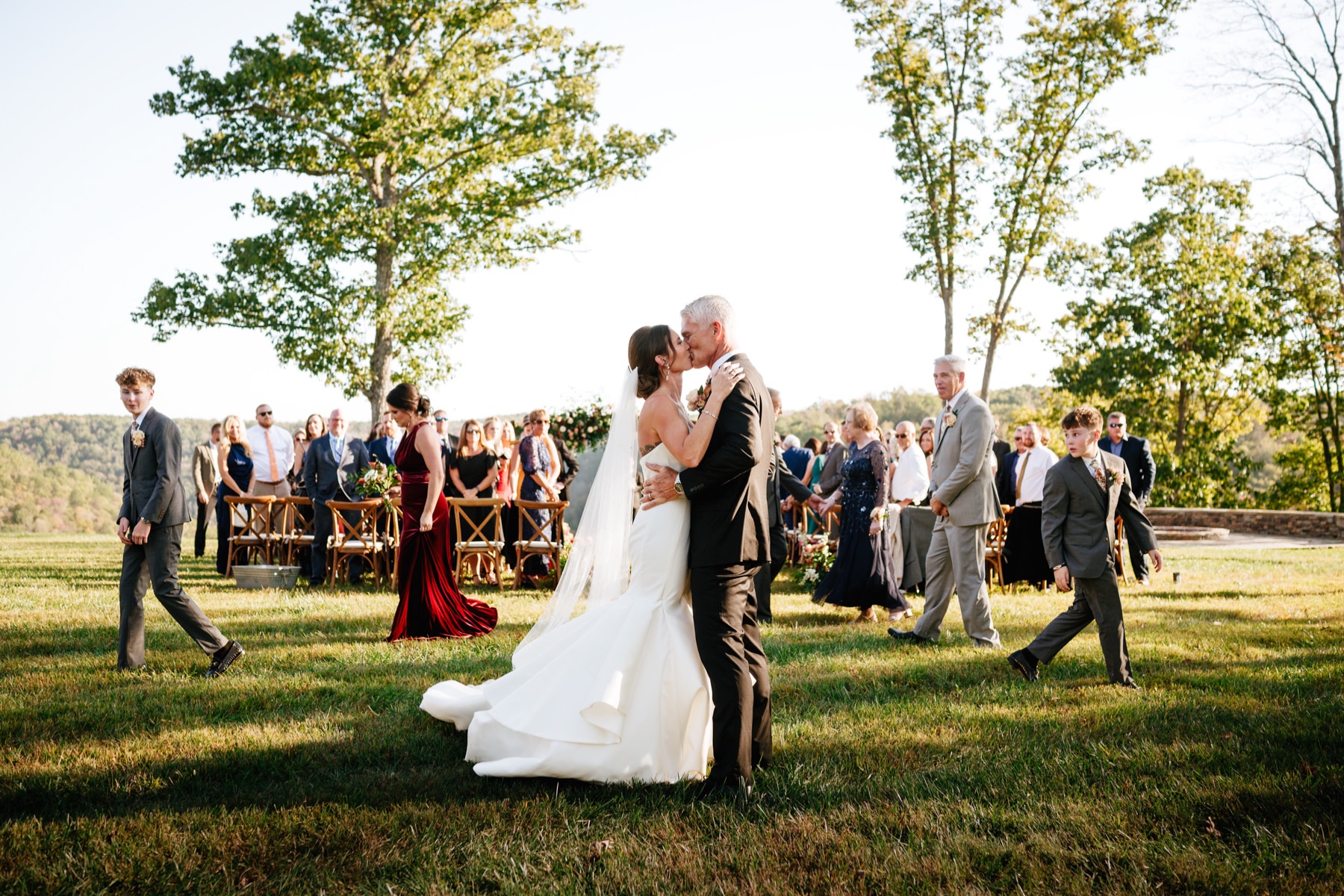 Bride and groom kiss after their ceremony at a Wilderness Lodge Summersville WV wedding.